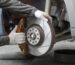 side view worker repairing car